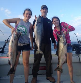 Salmon fishing on the easter basin of lake ontario on a charter boat